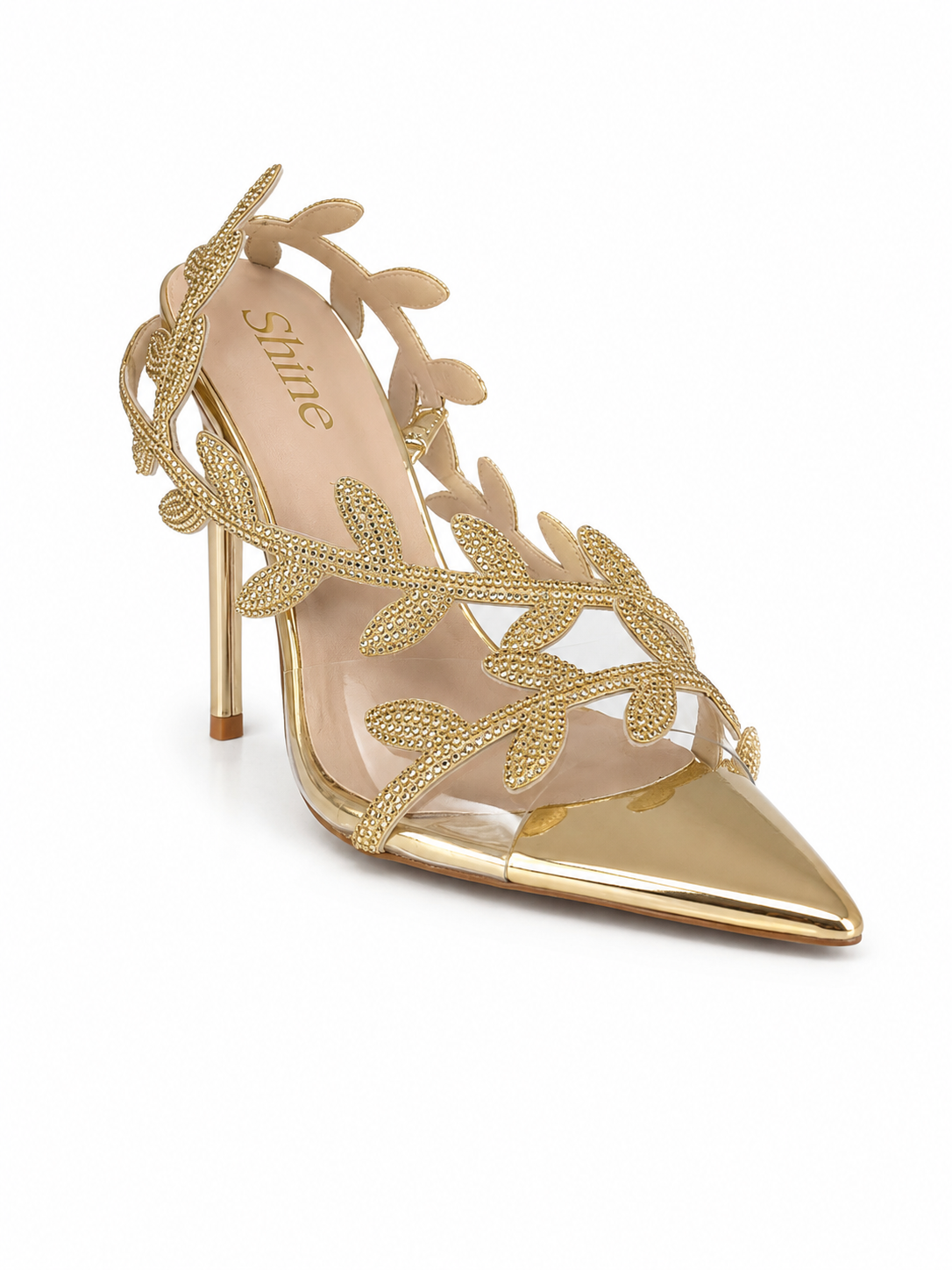 Tacón stiletto dorado de punta fina con hojas caladas y parte transparente